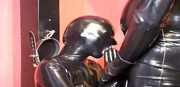 Black latex and rubber cock